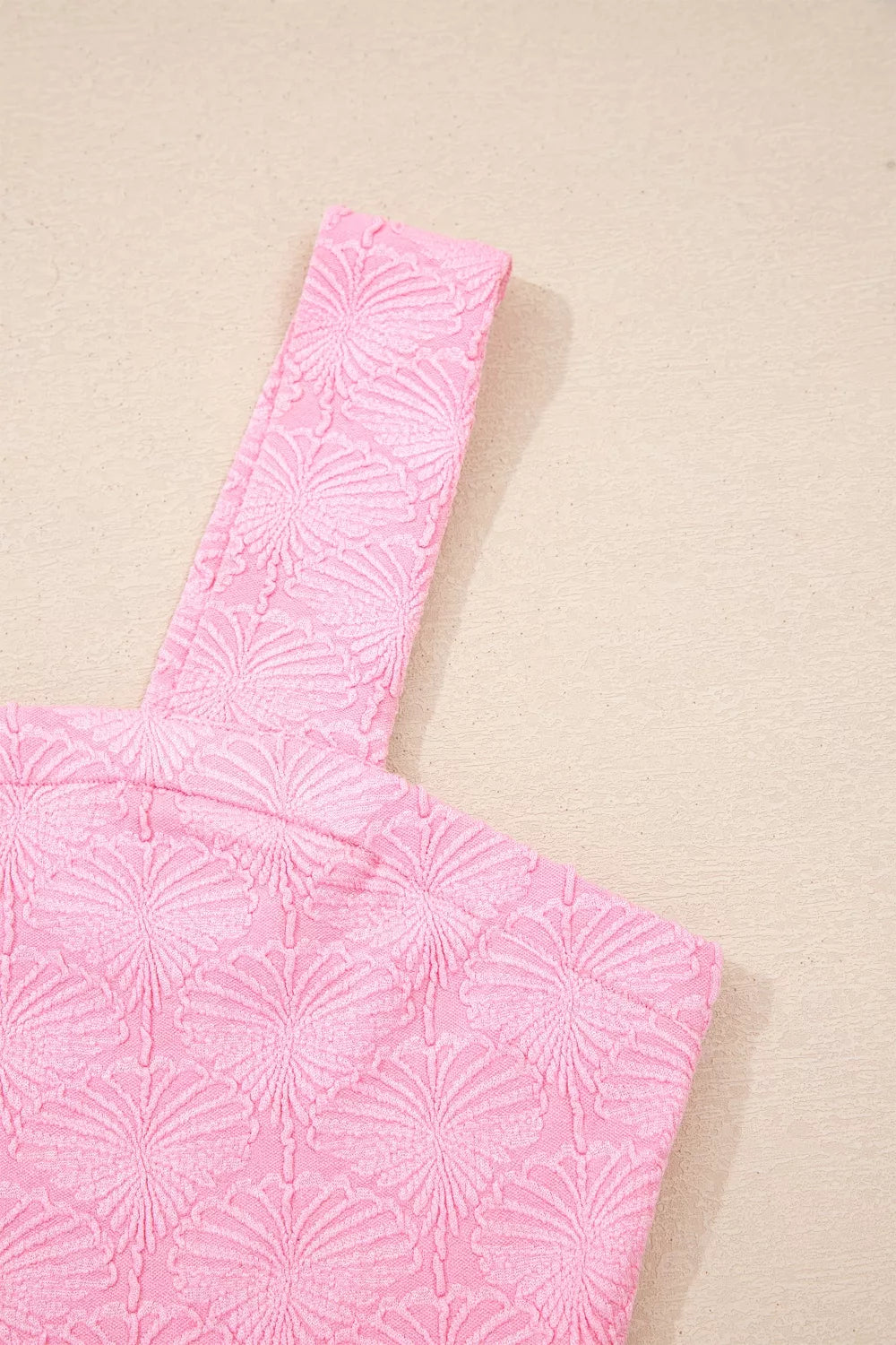 Pink sleeveless tank shoulder detail