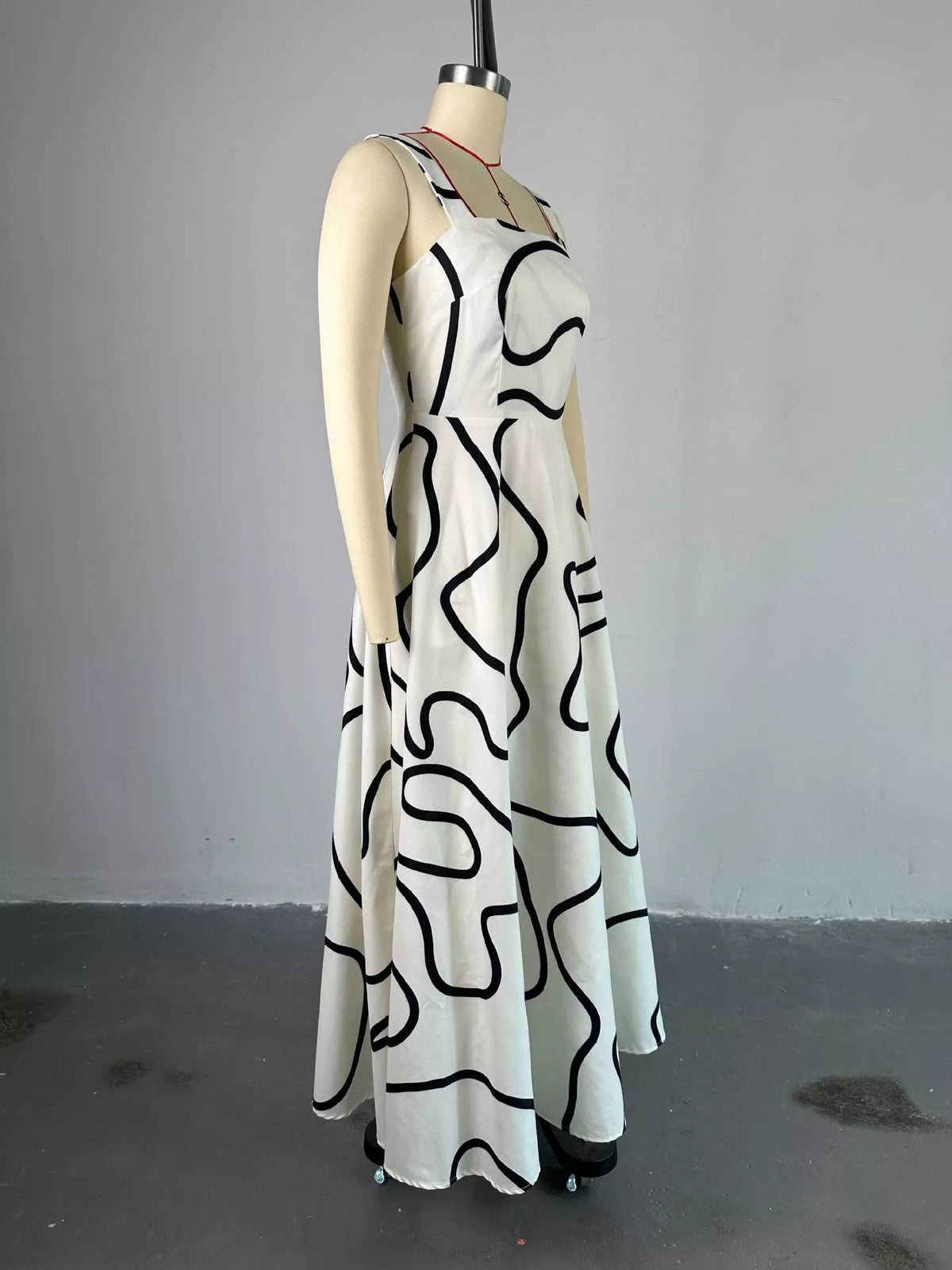 Abstract print dress shown in the pink colorway