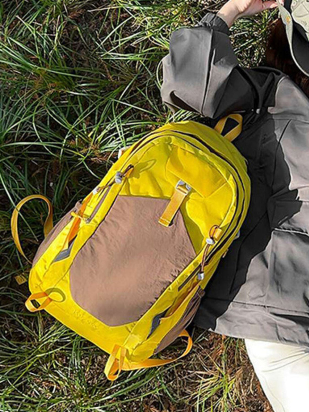 Yellow color block nylon backpack zip and hardware detail