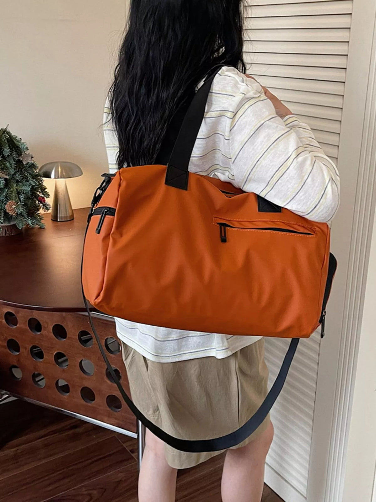 Orange multi pocket Oxford travel duffel front view