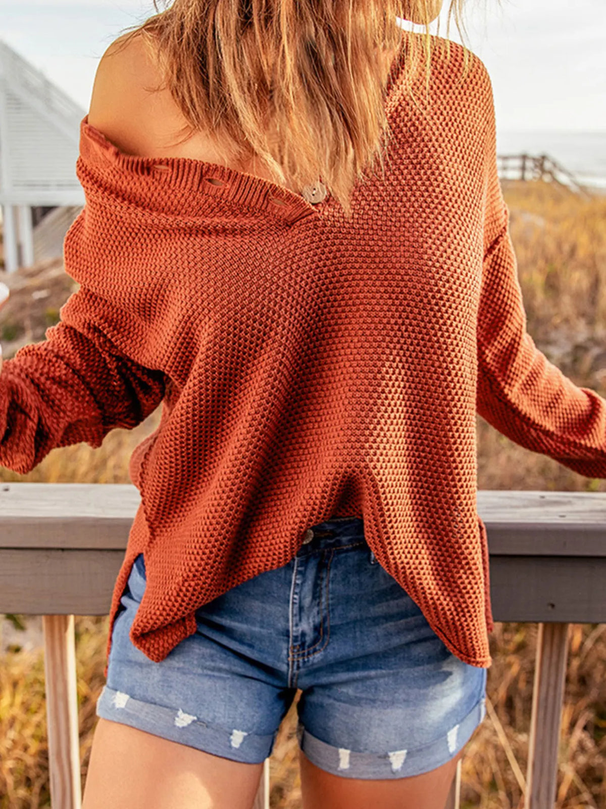 Button detail knit top side view