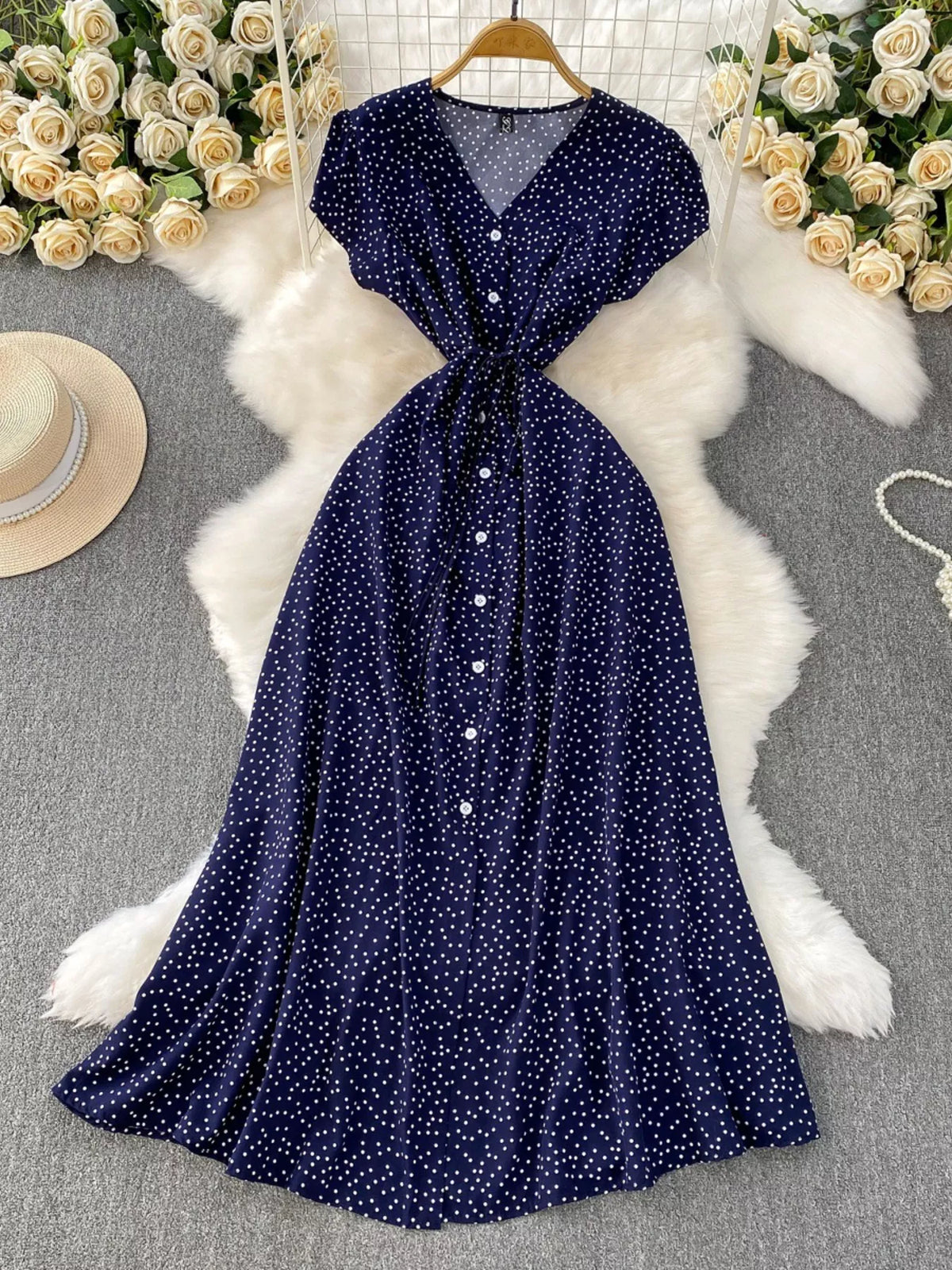 Dark blue polka dot button up belted maxi dress front view