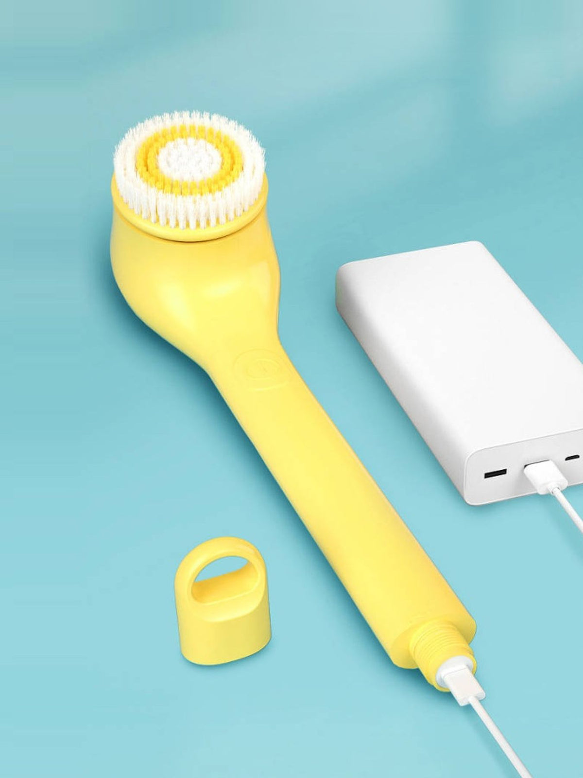 Facial cleansing brush in yellow