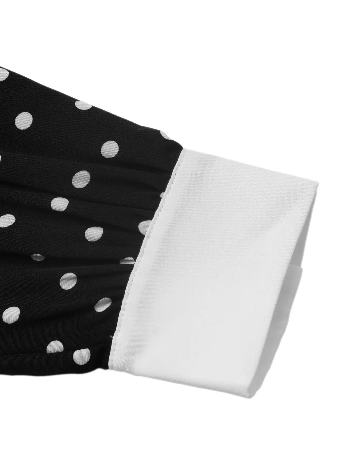 Polka dot dress styled with flat shoes