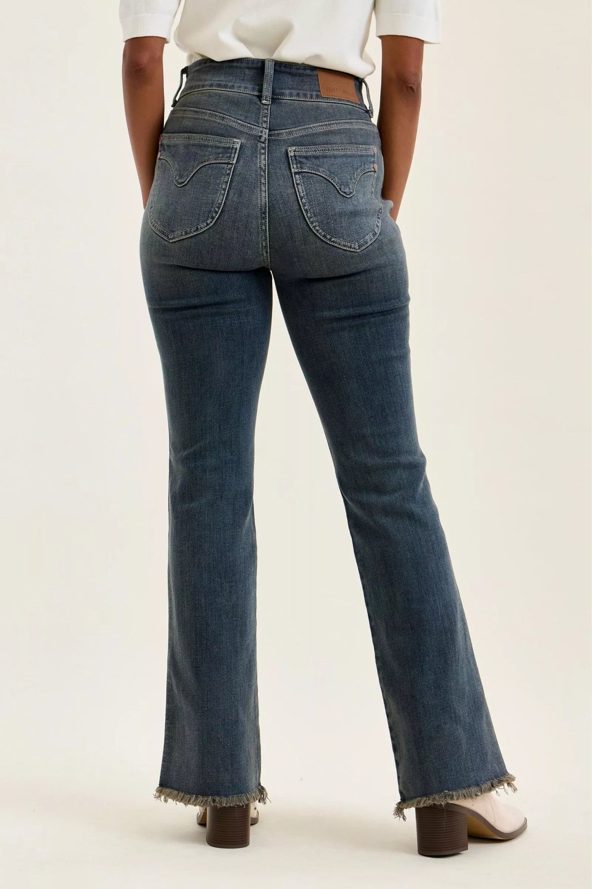 Double button closure detail on high waist jeans
