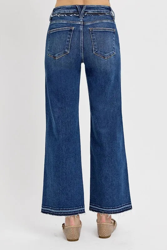 Raw hem detail on dark bootcut jeans