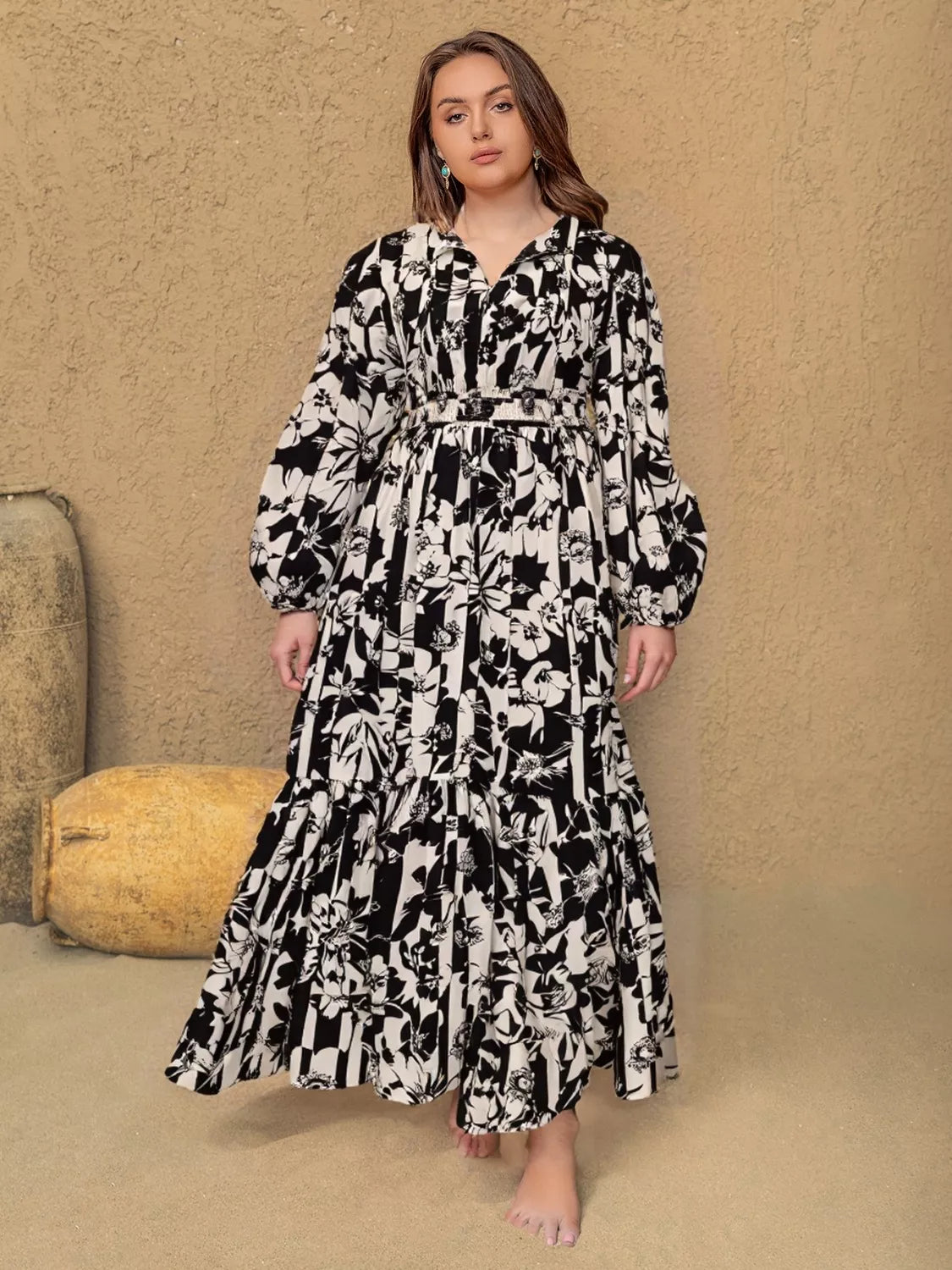 Plus size floral balloon sleeve maxi dress in black front view