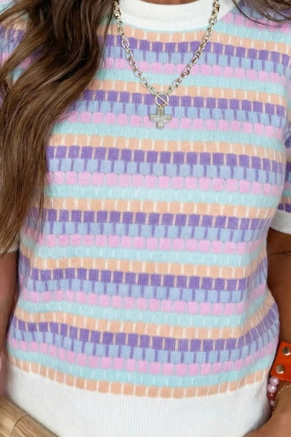 Colorful abstract striped sweater styled on model