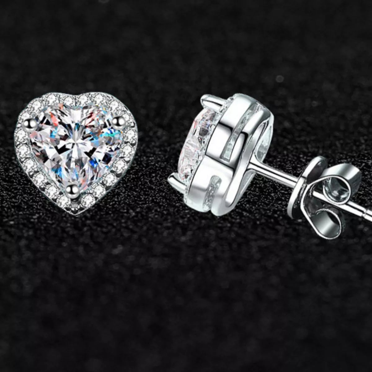 Heart shaped moissanite sterling silver stud earrings detail view
