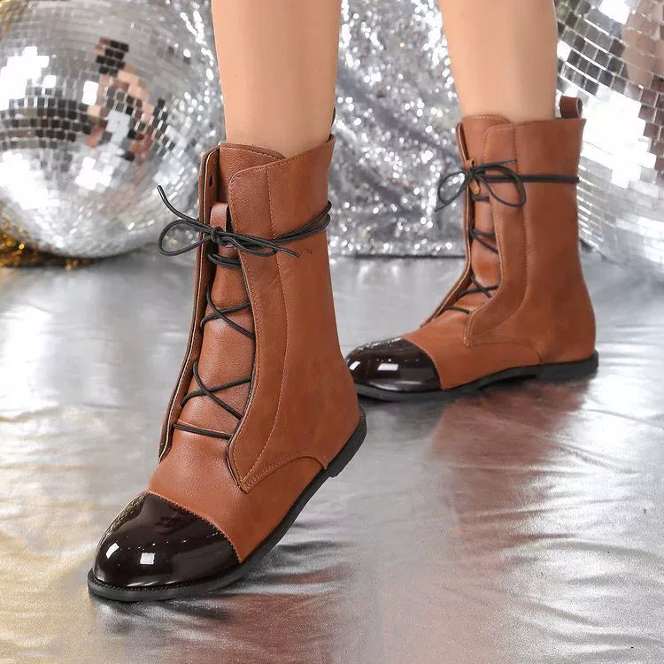 Brown lace up leather boots front facing view