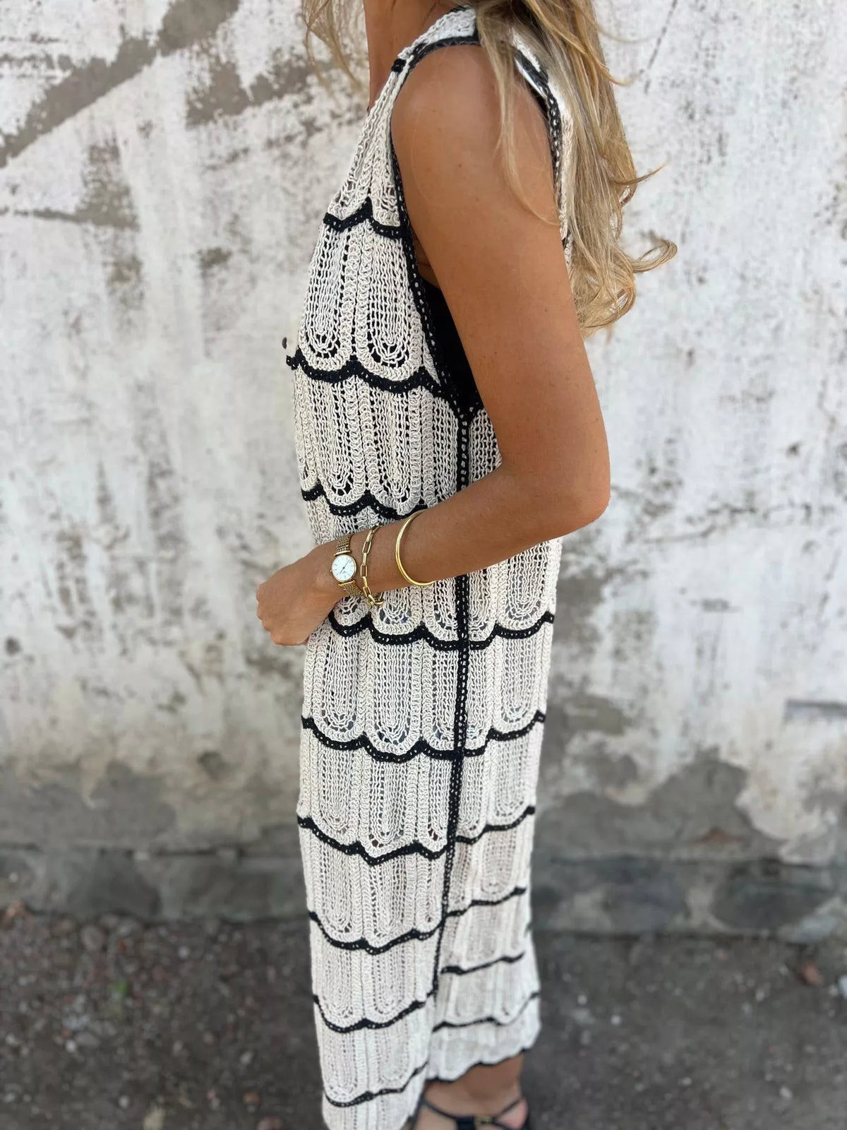 Side view of the longline sleeveless cardigan