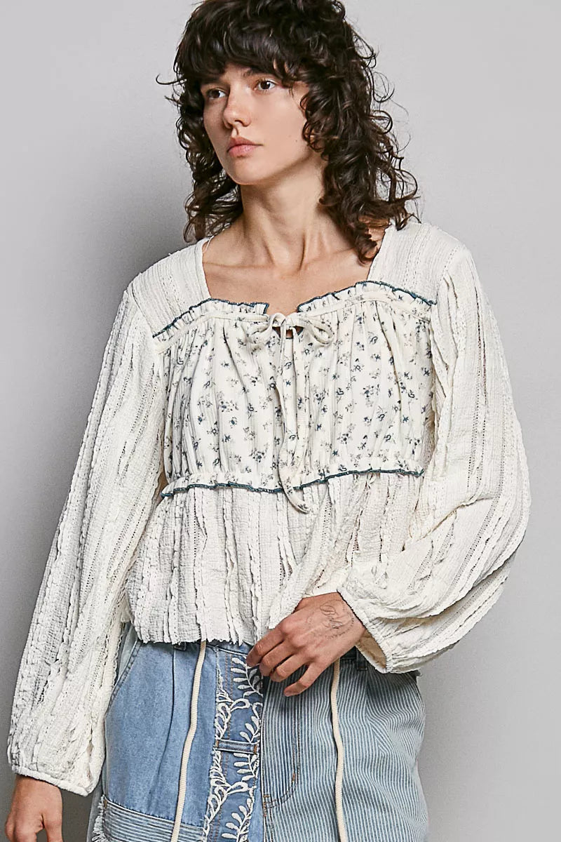 Cream lace top with balloon sleeves on model