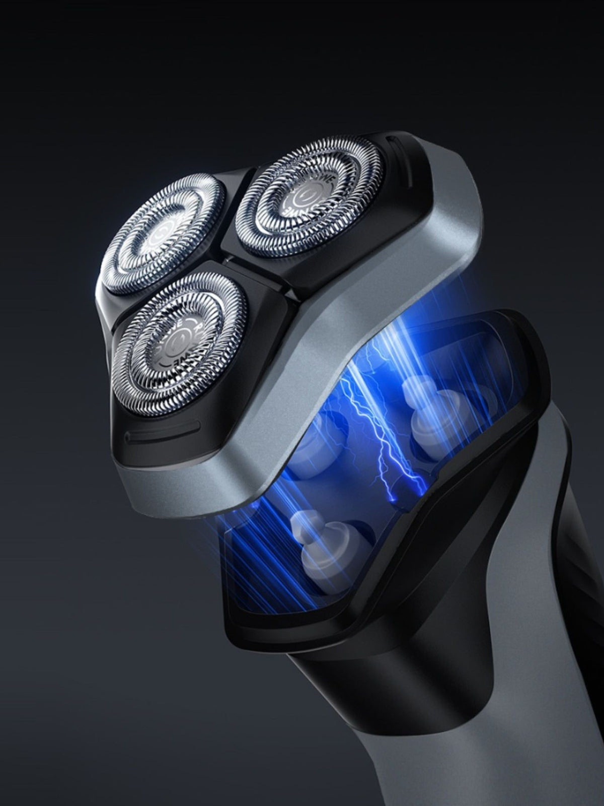 Electric shaver top view of triple rotary heads