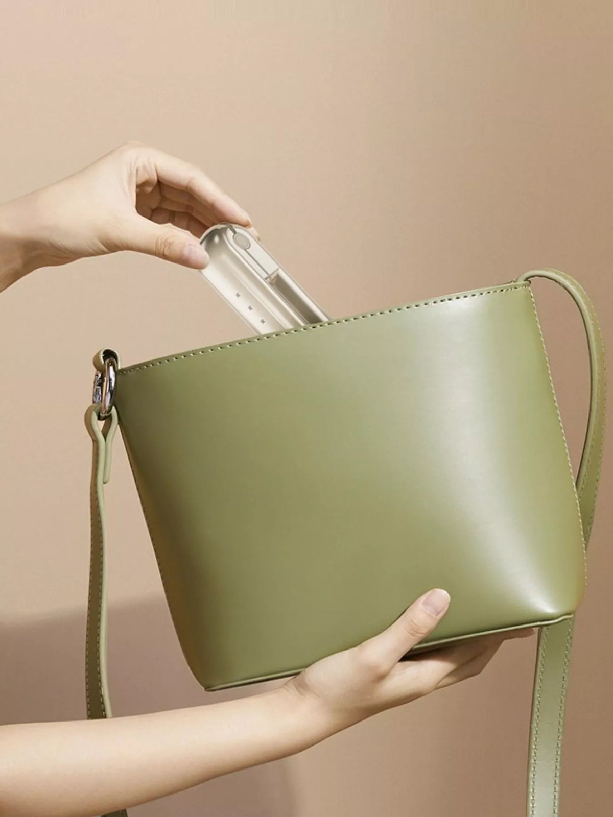 Hair straightener held in hand