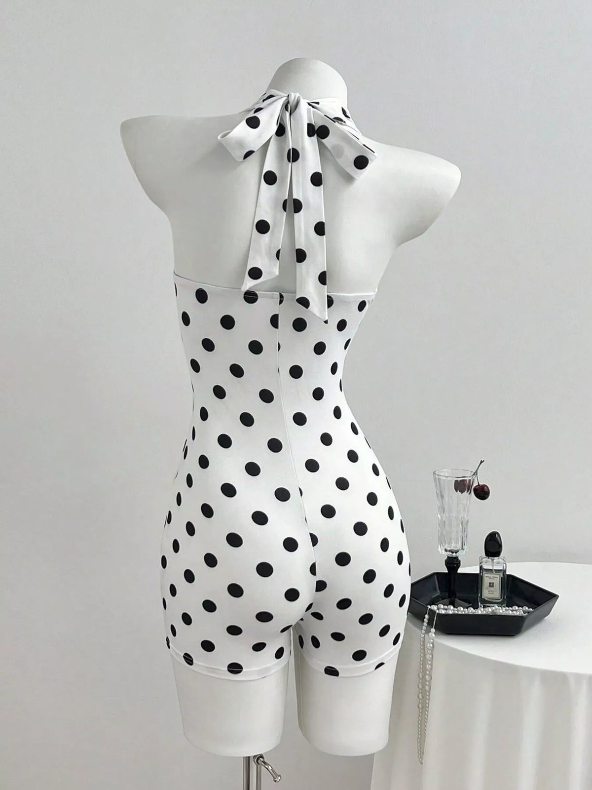 Close up of the polka dot print on white fabric