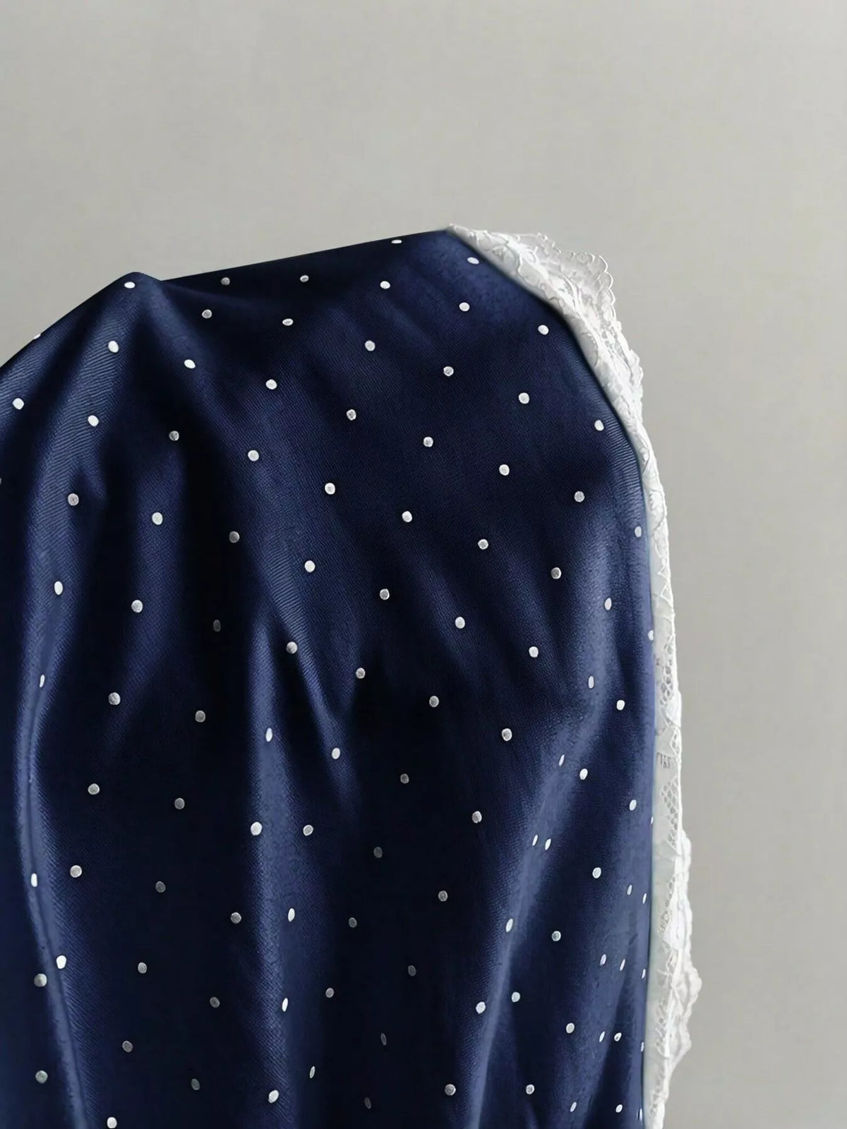 Polka dot print texture close up on the cami