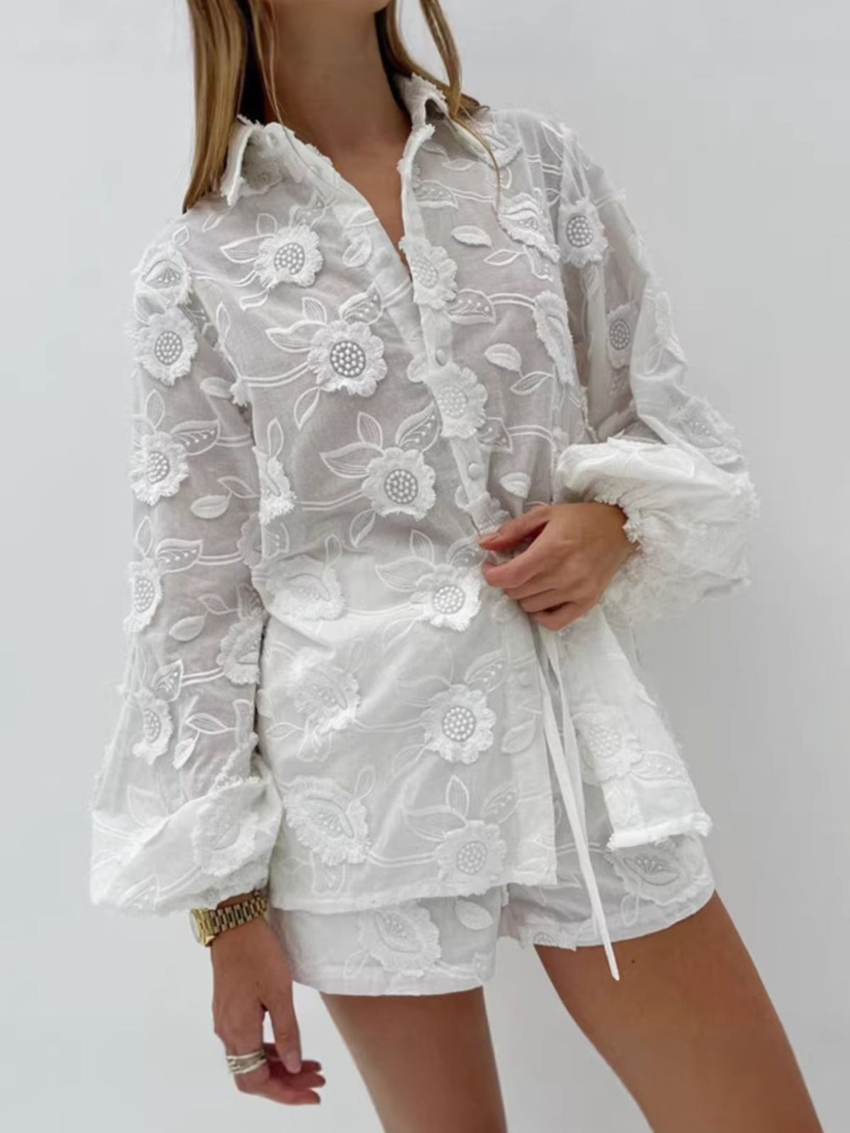 Floral embroidery detail on the button up shirt