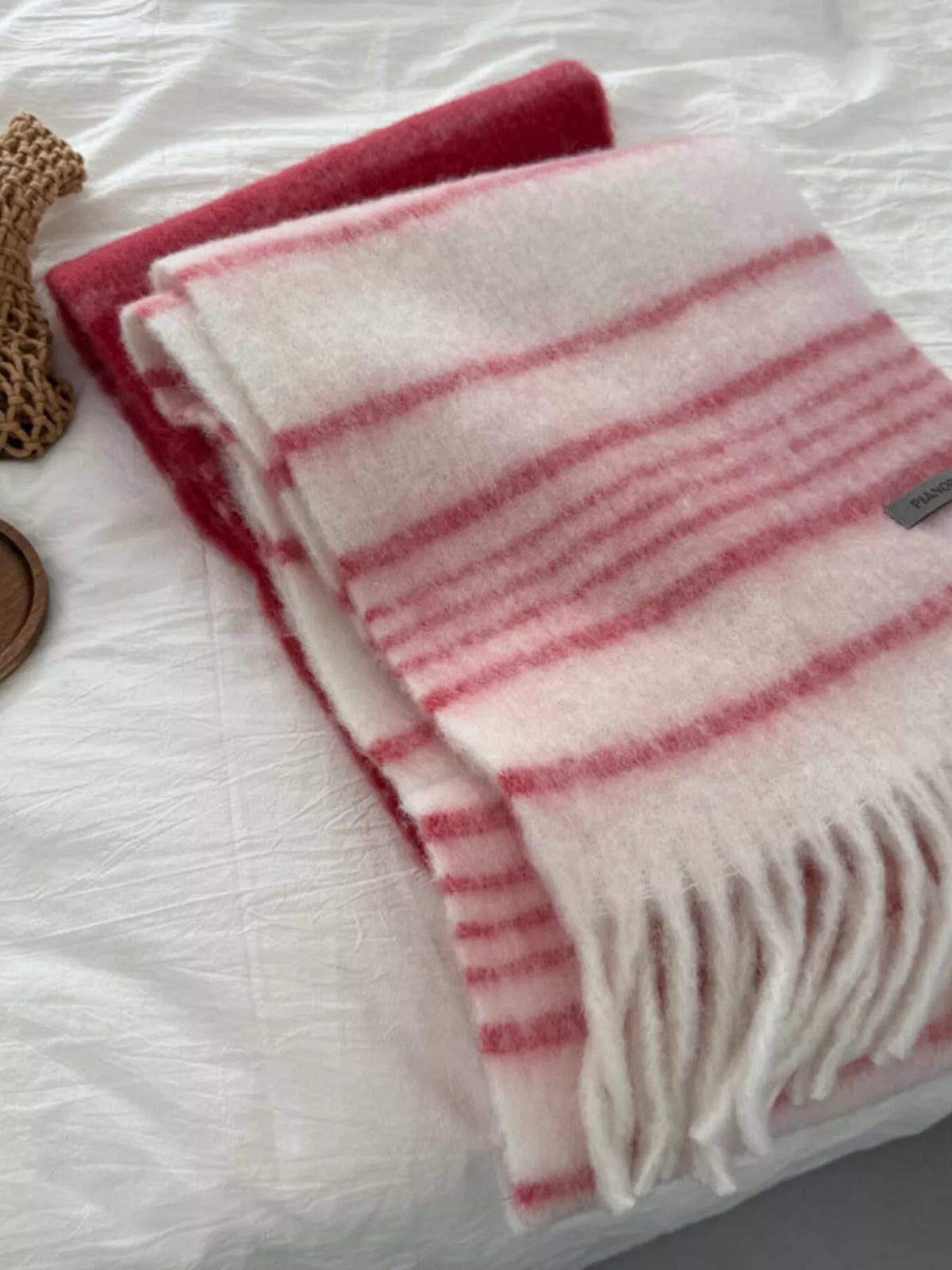 Striped scarf shown looped twice for a cozy look