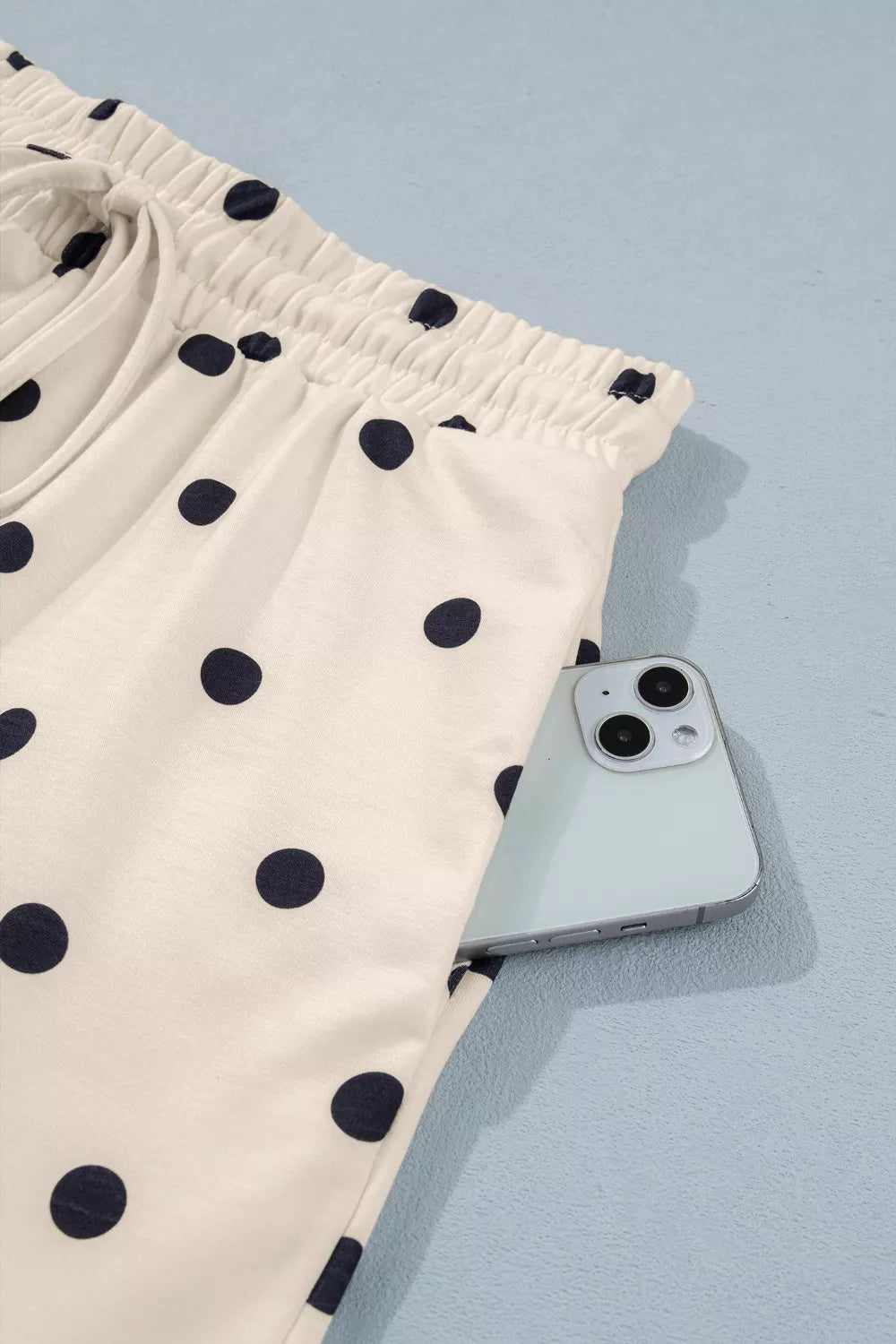 Polka dot tee and shorts flat lay