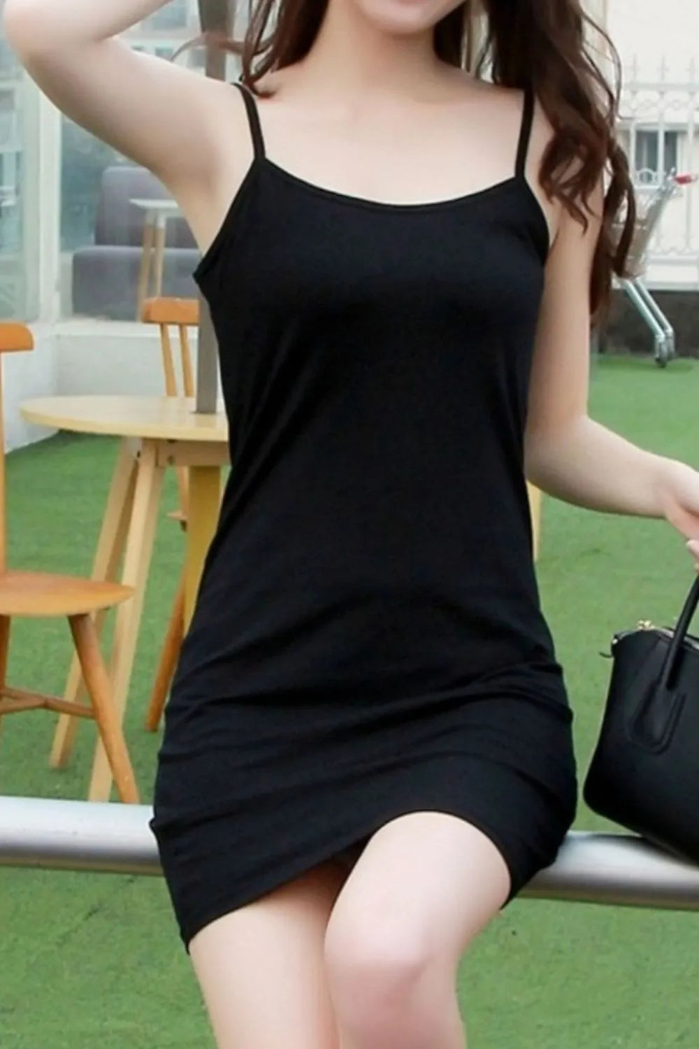 Black mini cami dress styled casually