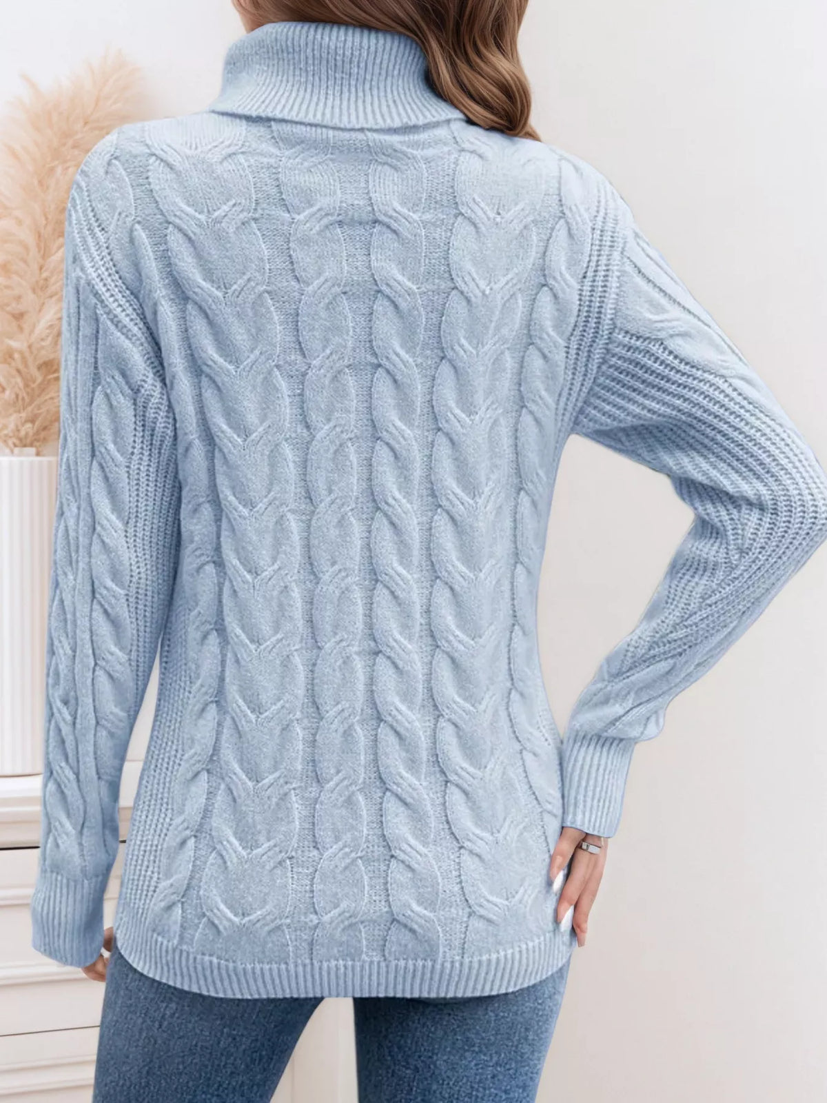 Cable knit turtleneck long sleeve sweater side view
