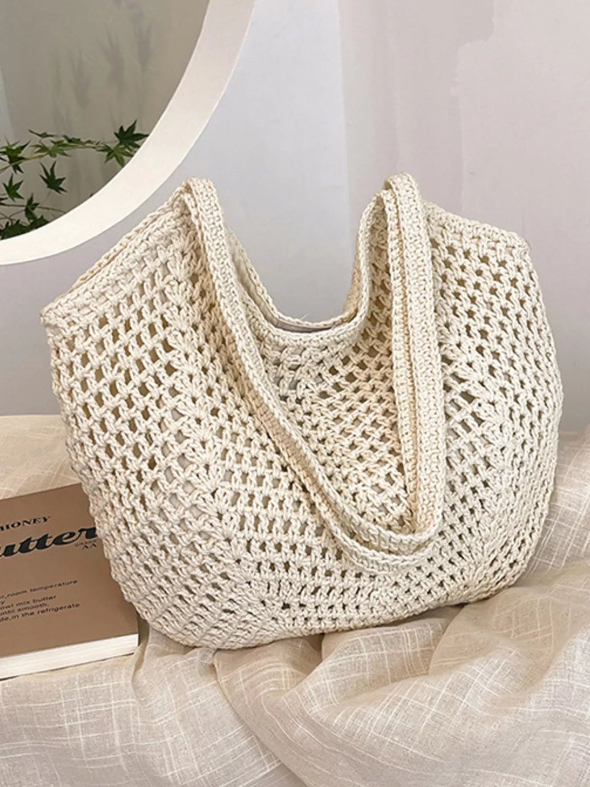 Straw shoulder bag worn on shoulder
