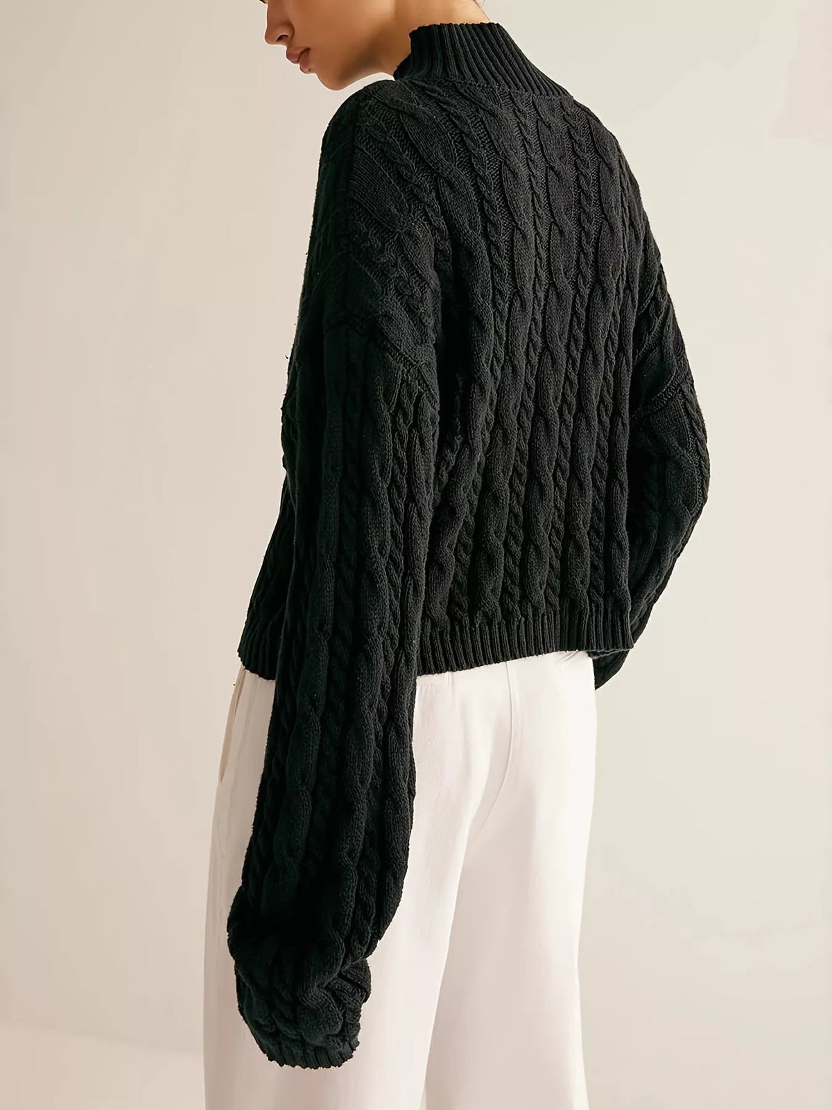 Black cable knit pullover sweater side view