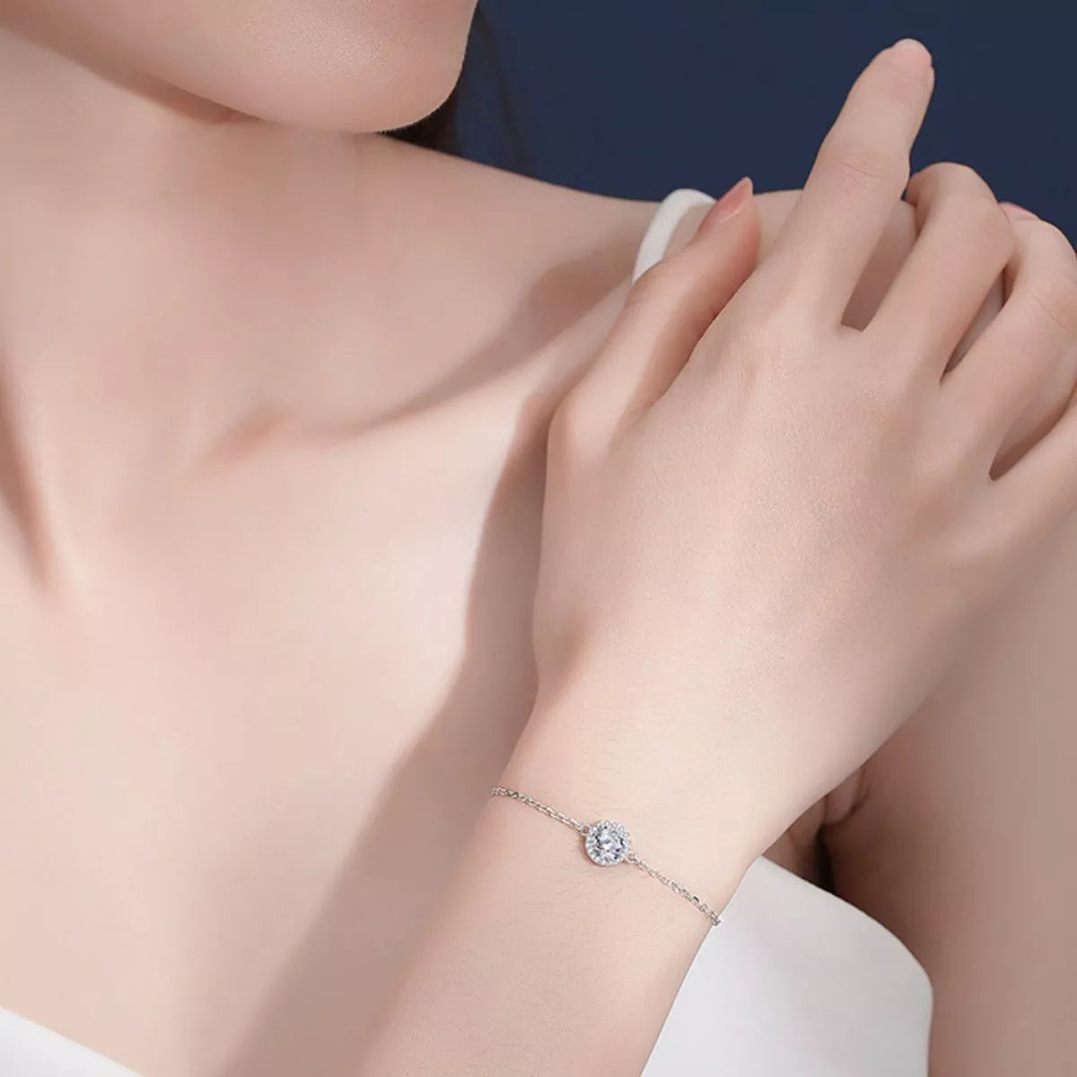 Moissanite bracelet in 925 sterling silver on a plain background