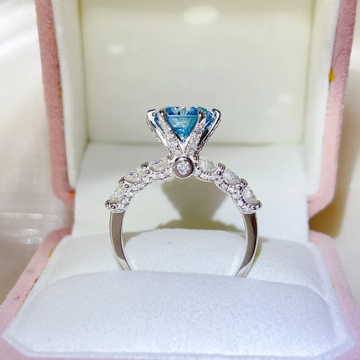Blue stone ring worn on a hand to show scale