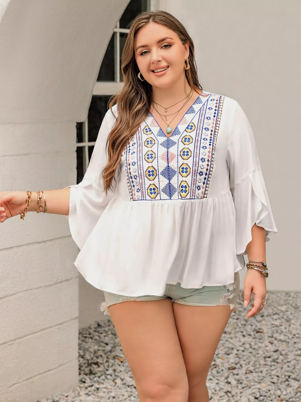 Geometric blouse V neckline detail