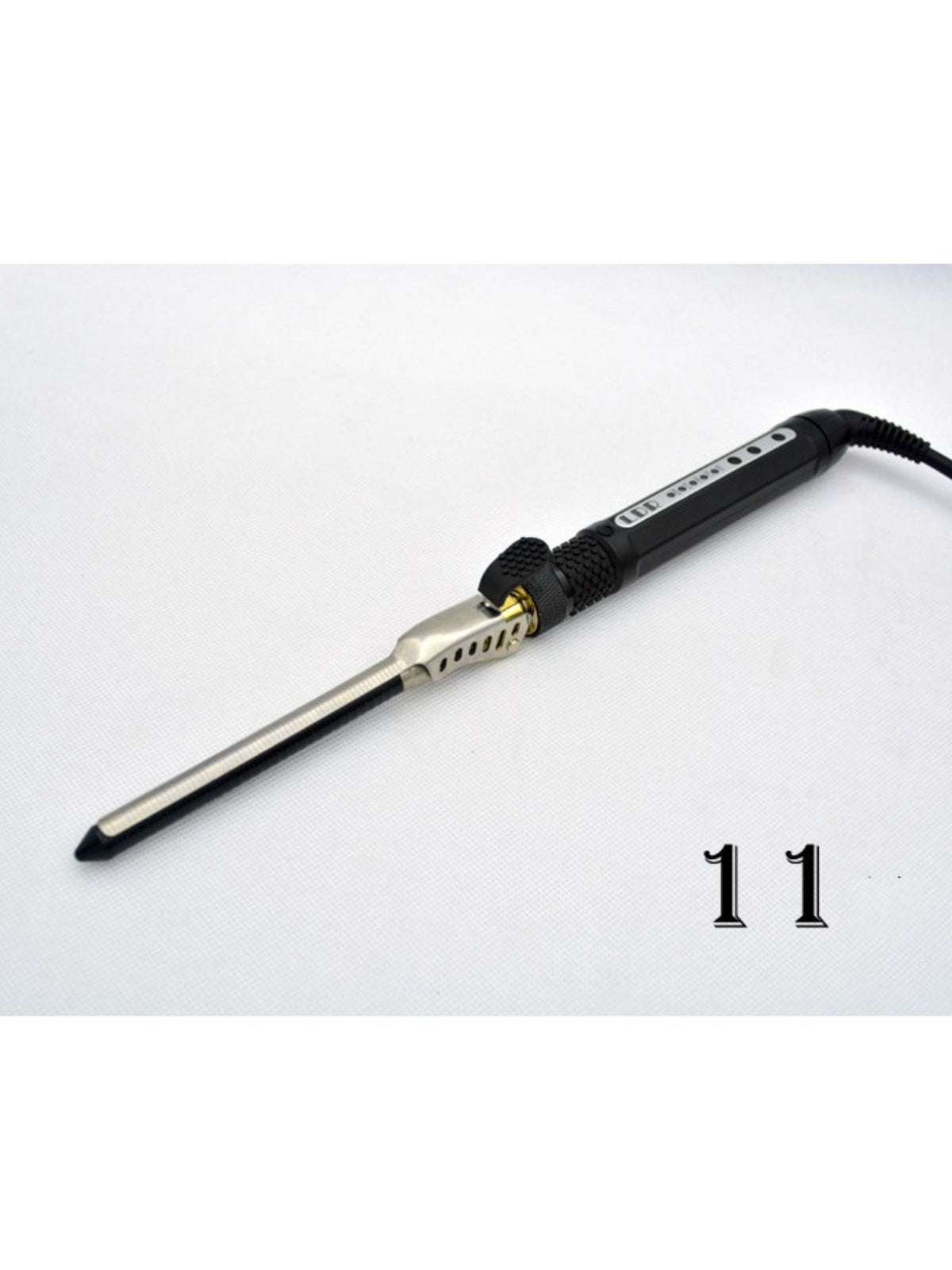 Curling iron in use on long hair