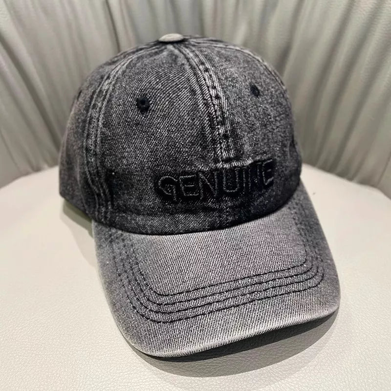Dark blue embroidered cap shown on a model