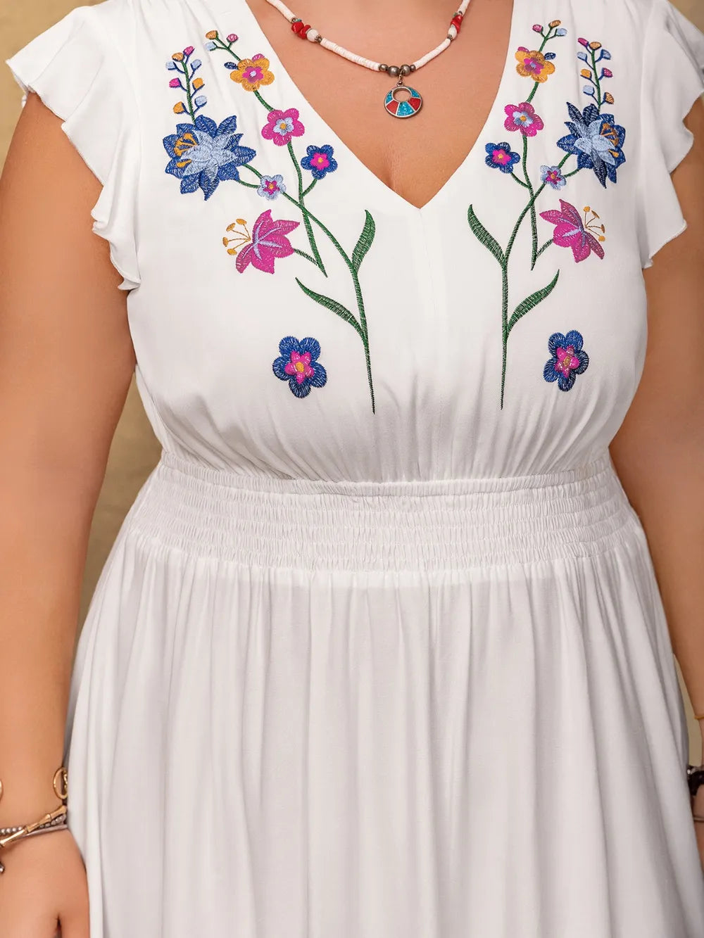 Plus size embroidered floral v neck maxi dress in white side view