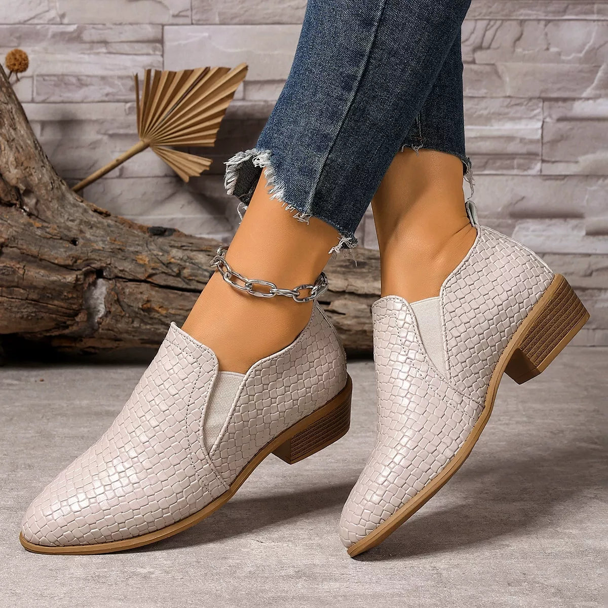 Beige point toe block heels ankle boots top down view