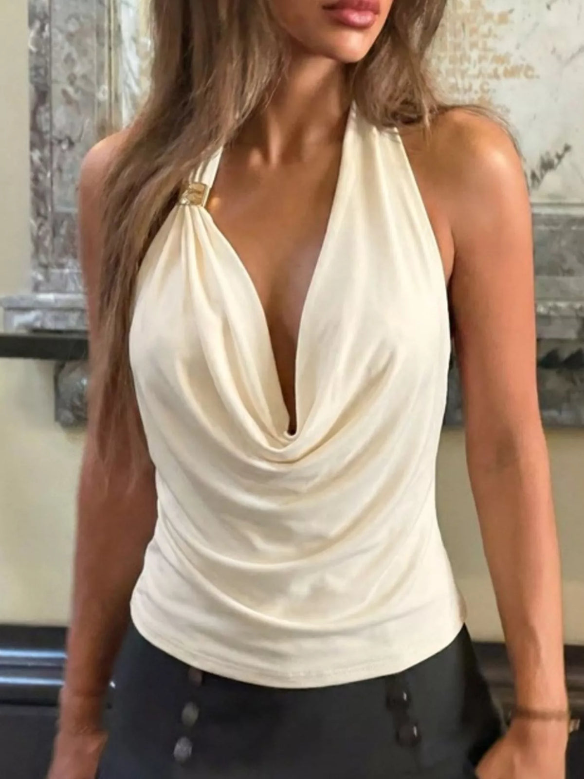 Ruched fabric texture close up on the apricot tank
