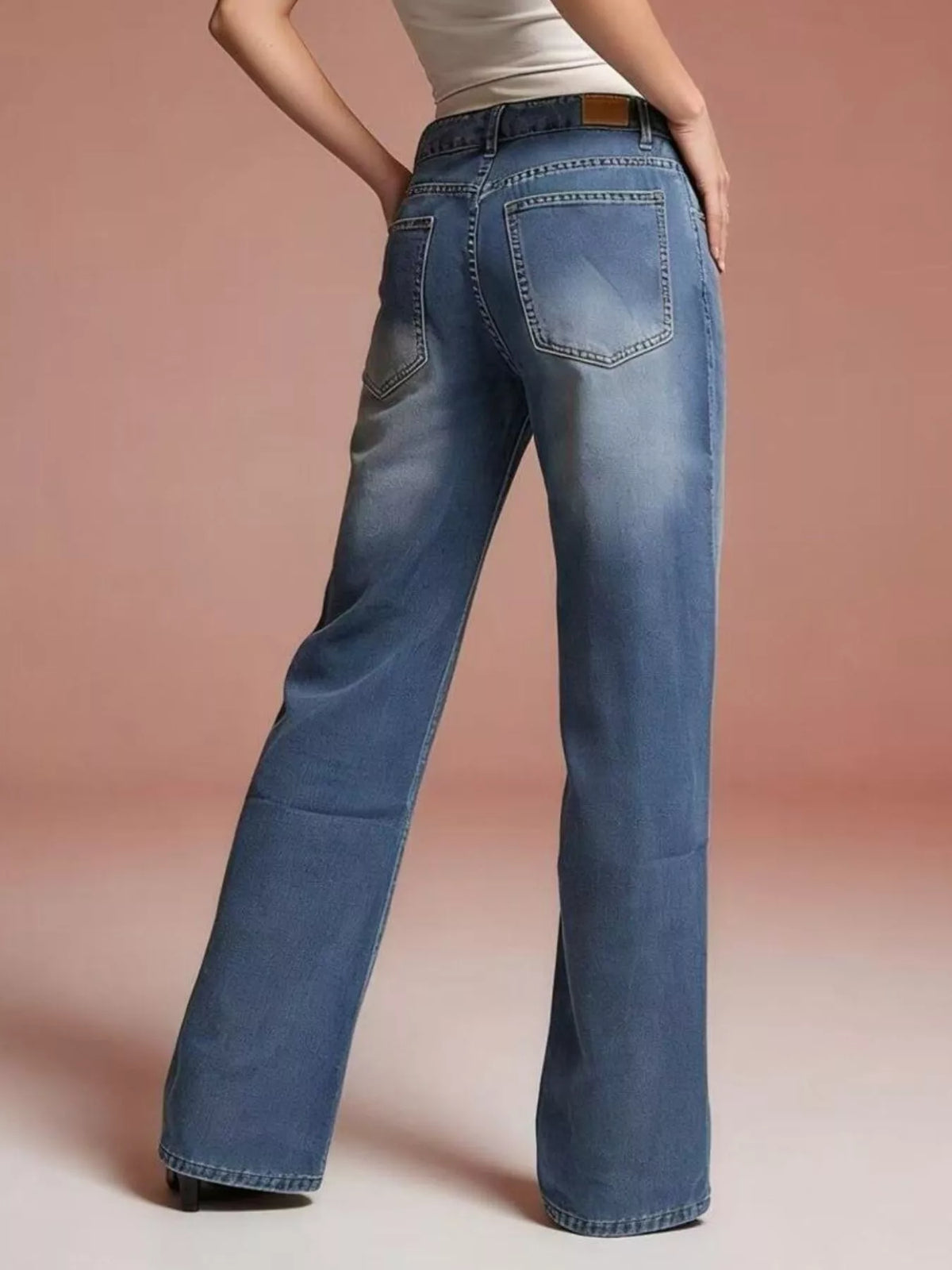 Full outfit view of vintage wash wide leg jeans
