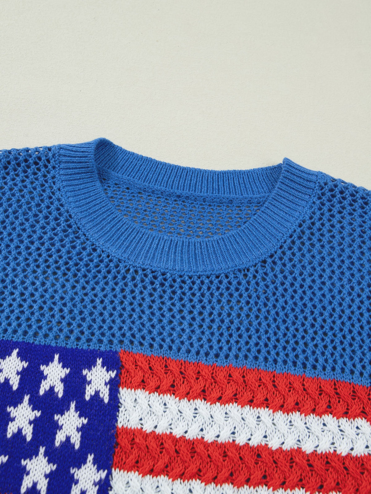 Flag graphic sweater top styled with jeans