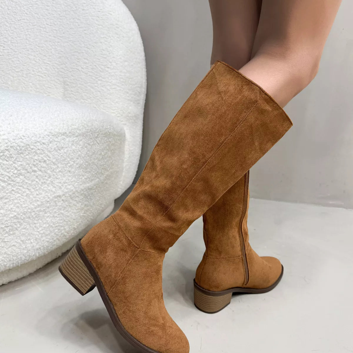 Knee high boots fastening detail