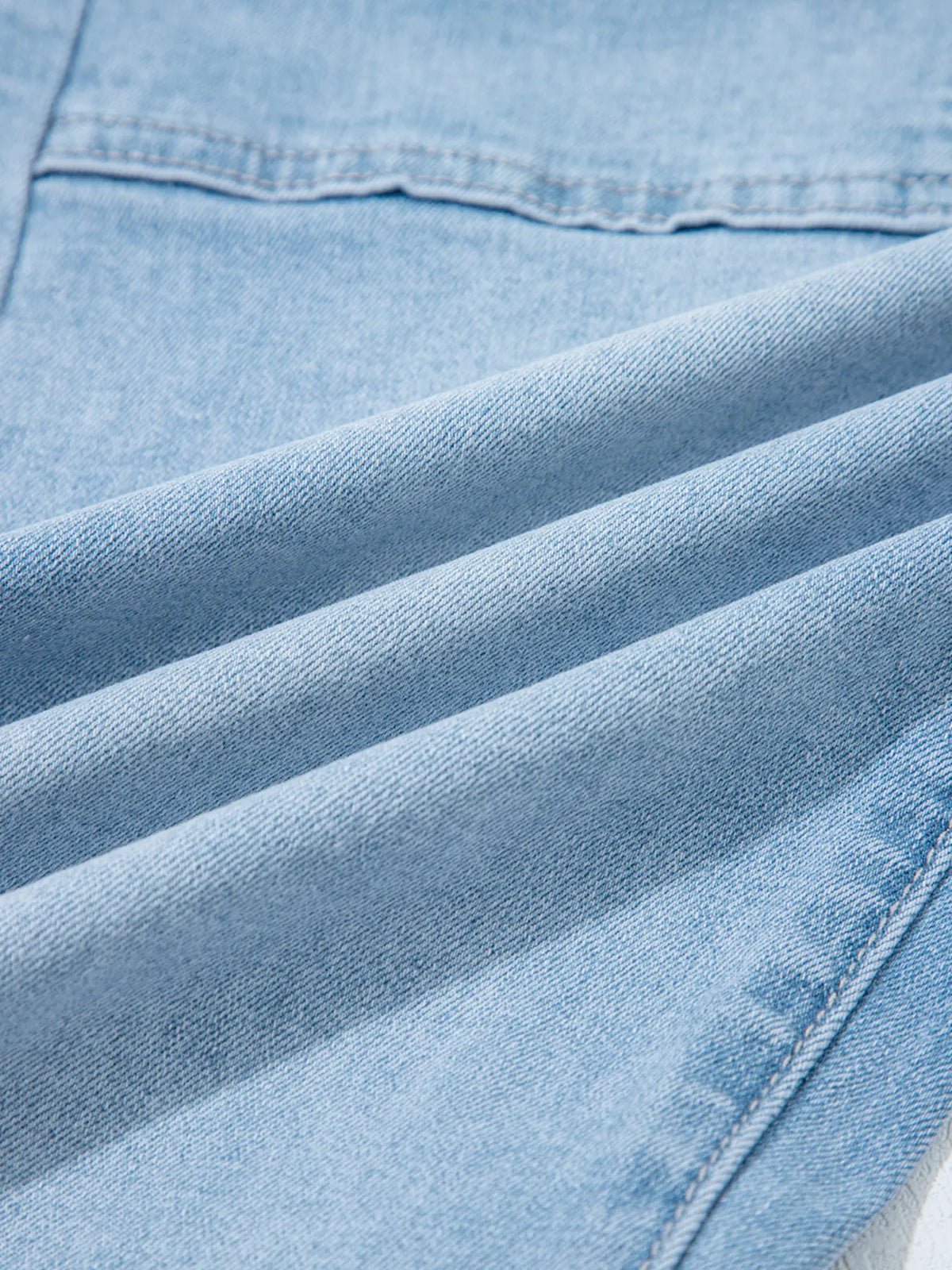 Angled pose in high rise barrel jeans