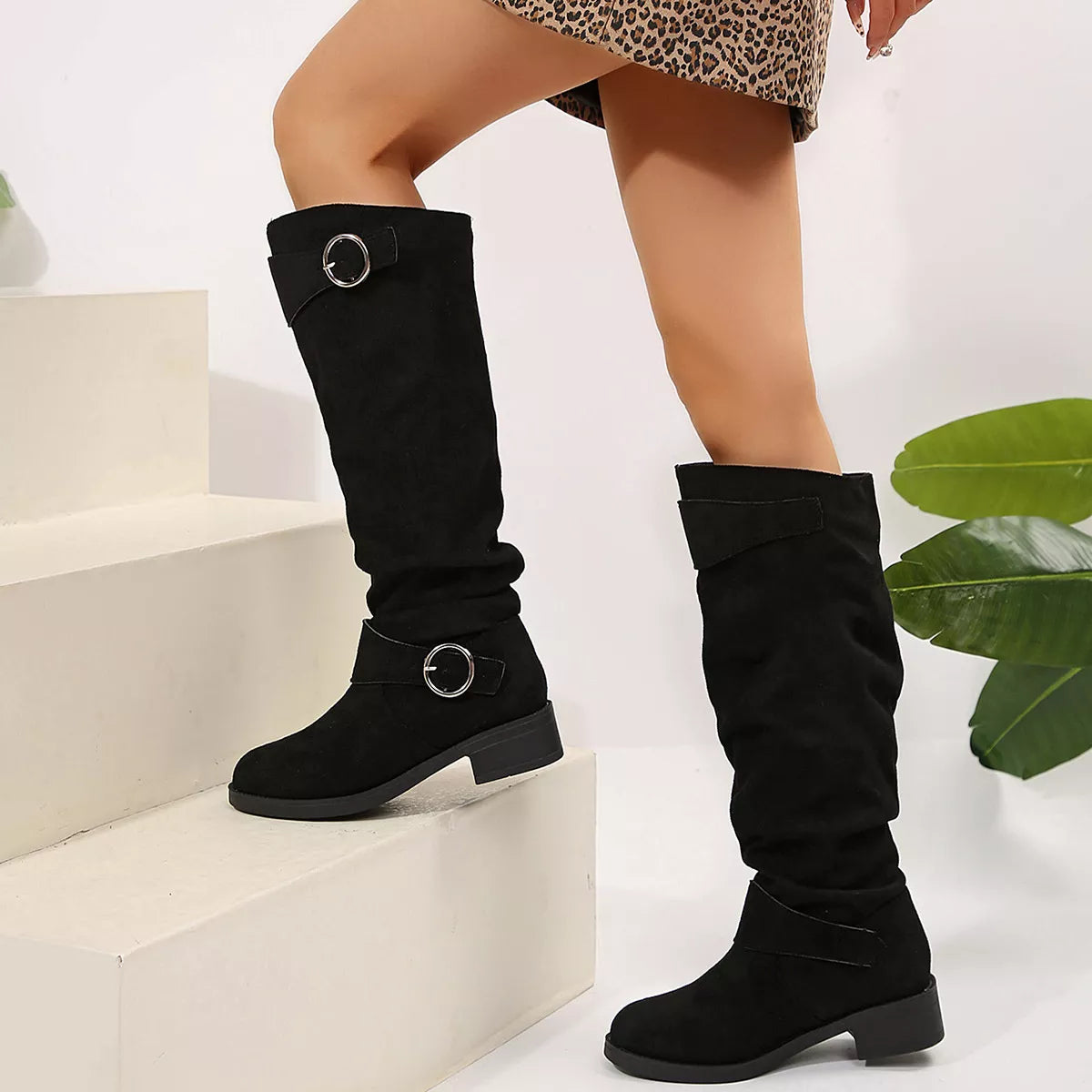 Khaki buckle accent slouch boots angled three quarter view