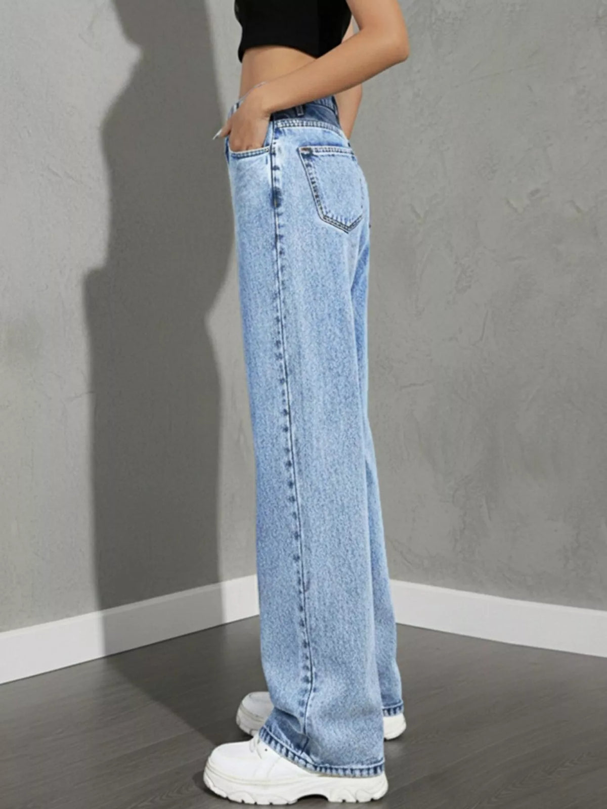 Wide leg jeans shown in light blue wash