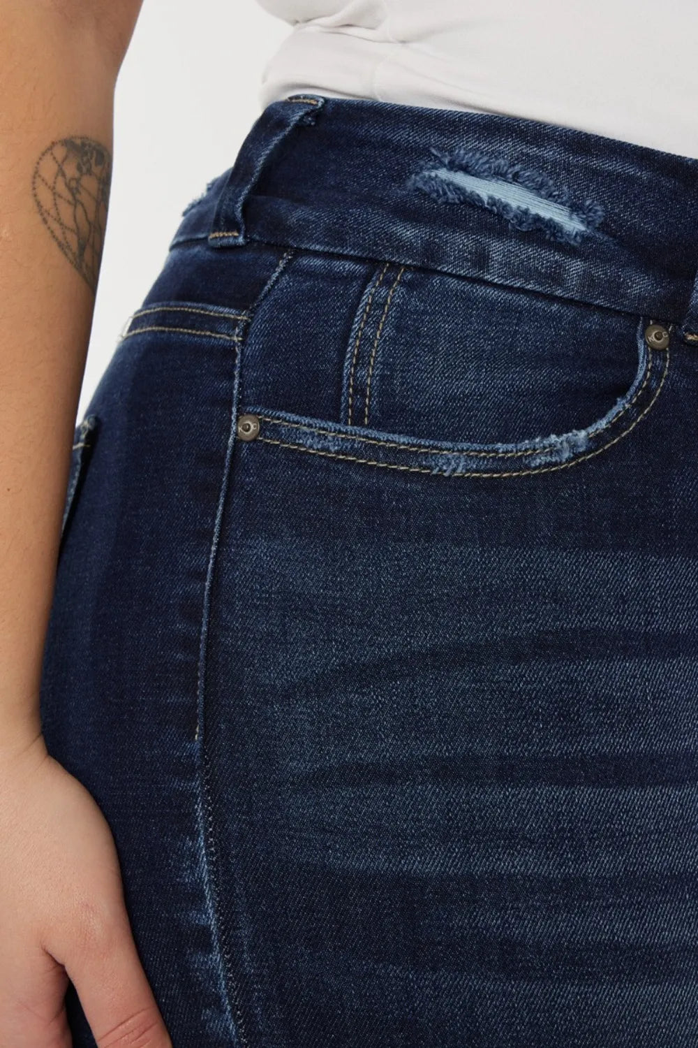 Cat whisker high rise jeans detail