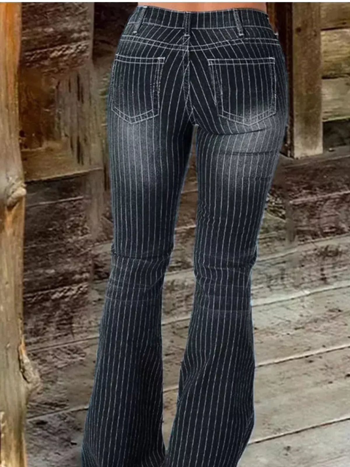 Full length flare jeans pose
