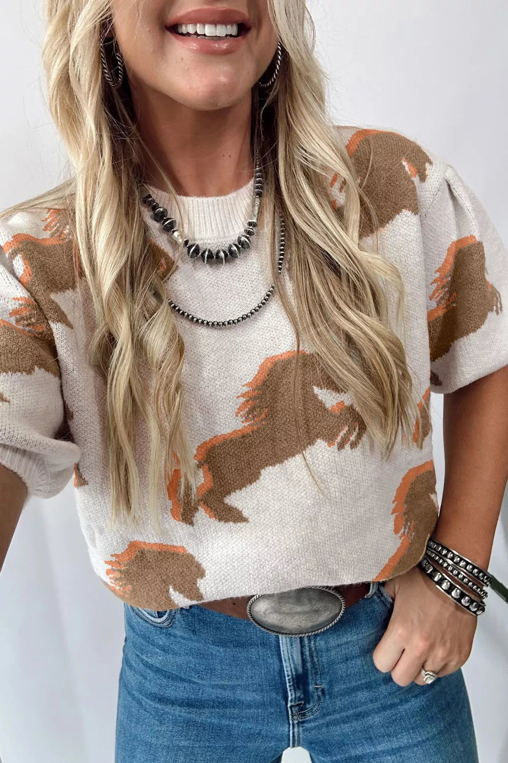 Beige knit sweater with horse motif side view