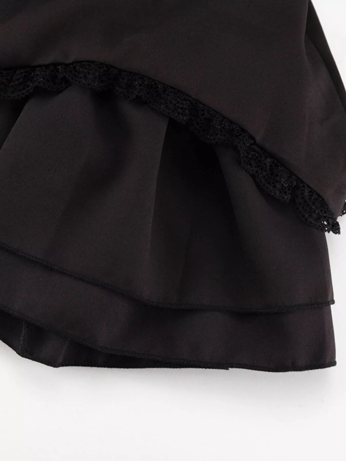 Full length styling shot of the tie shoulder mini dress