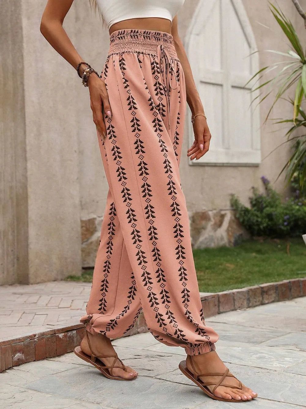 Tie waist printed high waist pants walking pose