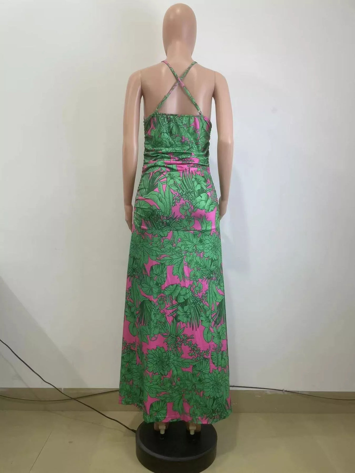 Fabric print detail of the green halter neck dress