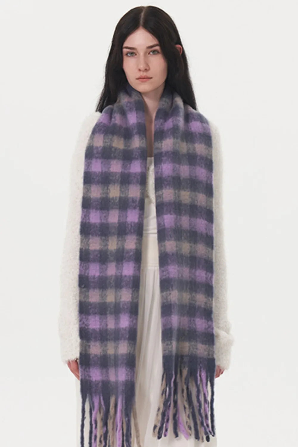 Fringe plaid scarf styled with a neutral coat