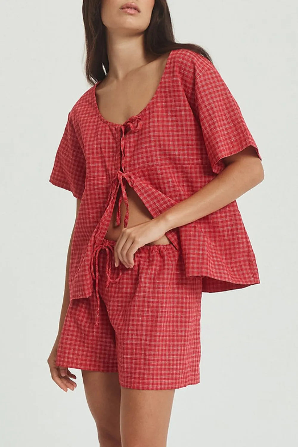 Plaid Tied Scoop Neck Short Sleeve Top and Drawstring Shorts Set on model