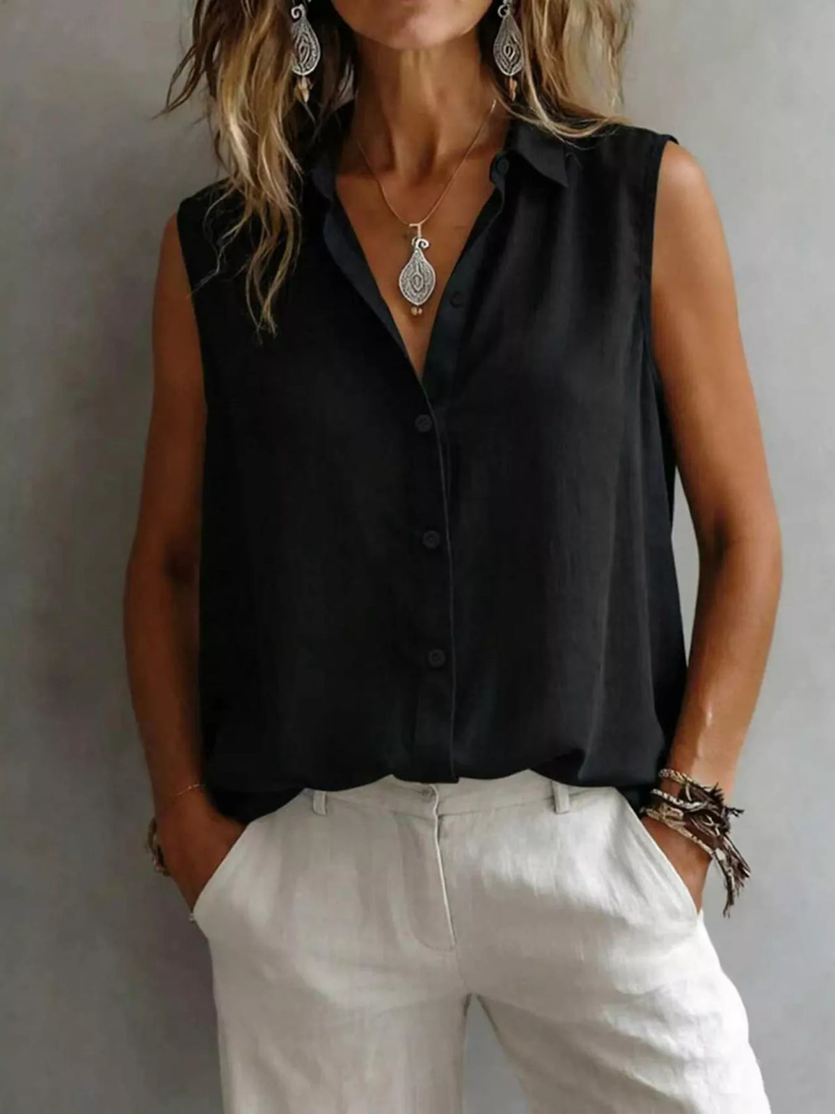 Sleeveless collared button down shirt front view